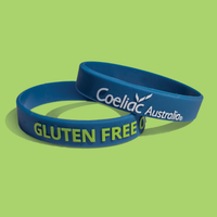 Blue wrist band featuring Coeliac Australia logo in white and the wording 'GLUTEN FREE ONLY' in bright green cap letters. 